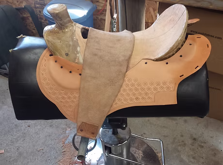 Installing the inskirt rigging plate after stamping. The front is blocked to fit the tree and it is drawn down to fit th